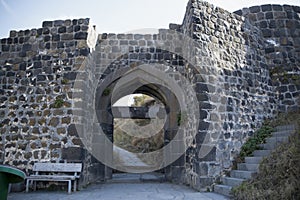 Ruins of an old castle. Entrance door and window of an old castle. Fortress towers and walls