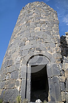 Ruins of an old castle. Entrance door and window of an old castle. Fortress towers and walls