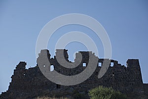 Ruins of an old castle. Entrance door and window of an old castle. Fortress towers and walls