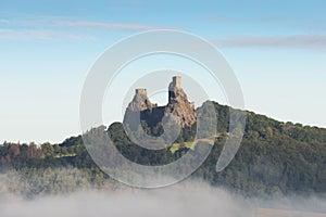 Ruins of old castle Trosky in Bohemian Paradise, Czech Republic. Ruins consist of two devasted towers on the woody hill.