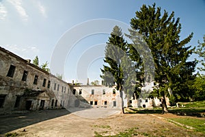 Ruins of the old Klevan castle. Ruined wall with windows against the blue sky. Courtyard. Rivne region. Ukraine