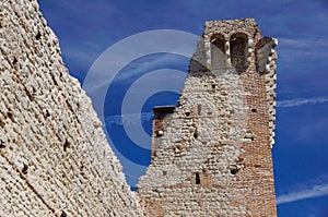 Ruins of old medieval castle . fortified wall and tower detail brick
