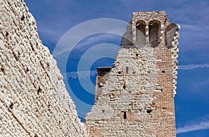 Ruins of old medieval castle . fortified wall and tower detail brick
