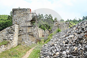 Man repairing of ruins of old monastery in Slovak Paradise