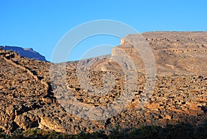 Ruins of old mudflat buildings in the city Biladt Sait in Oman photo