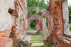 Ruins of old palace, partially destroyed brick walls of corridor