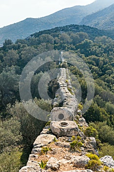 Ruins of old Roman Delikkemer aqueduct bridge at Lycian way