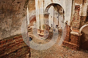 ruins of an old ruined church. red brick, ruined arches