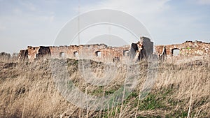 Ruins of an old stone building in the middle of the field