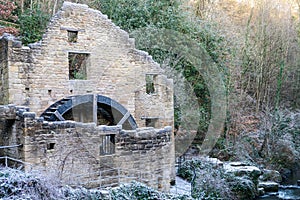 The ruins of the old water mill at Jesmond Dene, Newcastle upon Tyne, UK in winter.