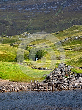 Ruins of old wooden jettty at Ardvreck Castle. Sutherland in the Scottish Highlands