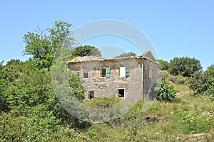 Ruins of once beautiful big house in the desert mountain village of The Old Perithia Ano Palea Perithia, Corfu Island, Greece, E