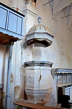 Ruins. Pulpit inside fortified medieval saxon evangelic church in the village Felmer, Felmern, Transylvania, Romania.