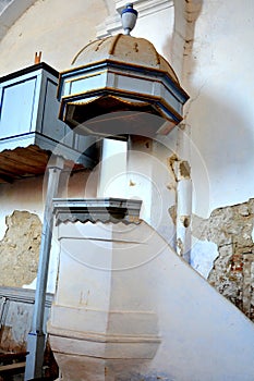 Ruins. Pulpit Inside fortified medieval saxon evangelic church in the village Felmer, Felmern, Transylvania, Romania.