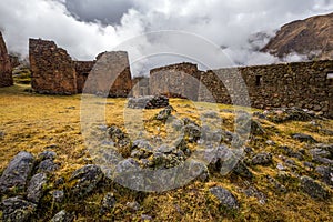 Ruins of the village of Pumamarka - Puma Marka, and llamas. Peru