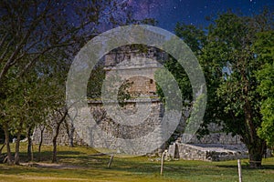 Ruins of red house in Chichen Itza, Yucatan, Mexico, Maya civilization with Milky Way Galaxy stars night sky