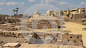 Ruins on the South side of the Avenue of Sphinxes leading to the first pylon of the Karnak Temple in Luxor, Egypt.