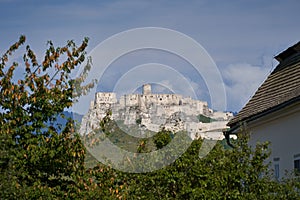 Ruins of the Spisky hrad in eastern slovakia taken from garden in city Spiske podhradie.