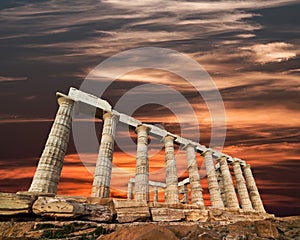 Ruins of the temple of Poseidon at Cape Sounion, sunset colors sk