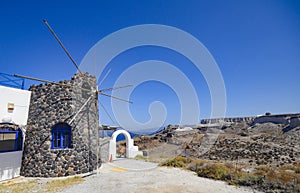 Ruins of traditional green windmill