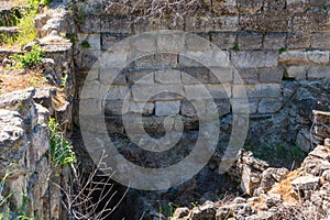 Ruins of Troy with texts on the stones. Visit Turkey concept image.