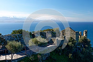 Ruins in the village of Nonza with the Monte Cinto in the background, Cap Corse in Corsica France photo