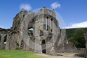 Ruins of walls and arches of old abbey in Brecon Beacons in Wales