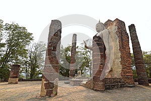 Ruins of Wat Saphan Hin at Sukhothai Historical Park, with its large 12m high standing Buddha image, Thailand