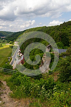 Ruins of Wolfsberg Castle and hill panorama with street near Obertrubach in Franconian Switzerland, Germany