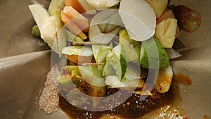 Rujak buah or indonesian mixed fruit salad, served with spicy brown sugar sauce and ground peanuts photo