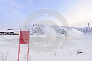 Rukatunturi ski jumping hill in winter season and nice weather and blue sky in winter season and sunset time at Ruka ski