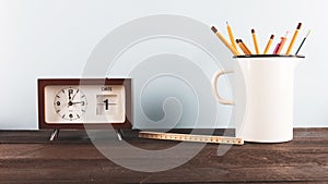 ruler pencils near clock. High quality photo