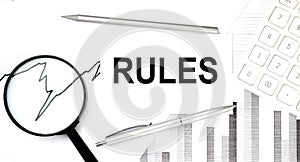 RULES document with pen,graph and magnifier, calculator,business concept