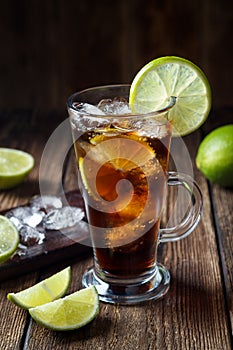 Rum and cola Cuba Libre drink with brown rum, cola, ice and lime