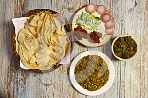 Rumali roti with egg tarka chicken curry and chicken pakora