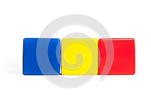Rumania flag colors: blue, yellow, red in the form of children`s cubes. photo
