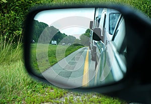 Rumble Strips on Road in Car Mirror