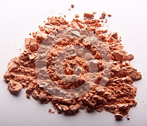 Ð¡rumbled natural powder make up on white background.