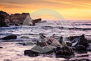 Rumbling Atlantic Ocean waves crash upon the rocks