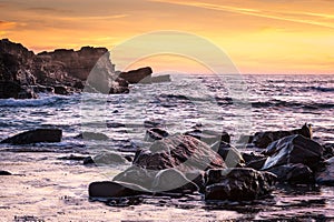 Rumbling Atlantic Ocean waves crash upon the rocks photo