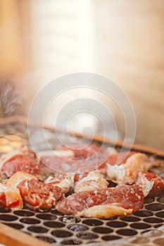 Rump barbeque on the grill. Meat with fat