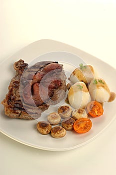 rump steak and bacon with vegetable