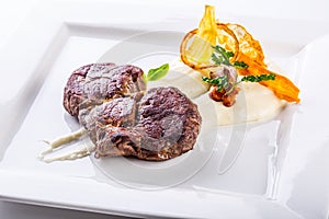 Rump steak. Close up Tender Grilled Beef Meat on White Plate with vegetable decoration.