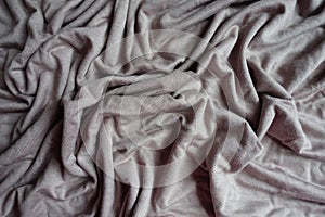 Rumpled grey viscose fabric from above