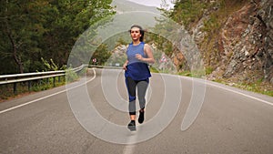 Run concept. Woman running in mountains in the morning. Motivated female jogging outdoors for lose weight. Young girl in sport clo