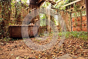 Run down dilapidated horse barn on an abandoned farm