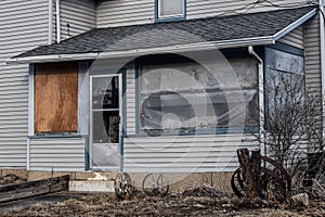 Run Down Screened Porch with Wagon Wheels