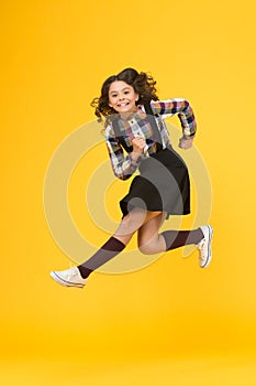 Run for fun. Happy kid have fun yellow background. Little child in midair. School holidays. Play and fun. Free times