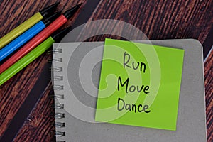 Run Move Dance text on sticky notes with office desk