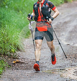 Run rain,Cross country runner,Trail running in the forest,uphill in autumn trail of mud and stones,In the north of Thailand,blur,S